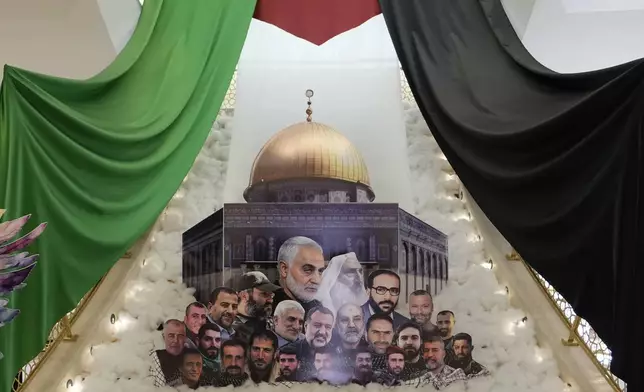 A display showing slain Iranian military officials and allied Lebanese and Palestinians next to the al-Aqsa Mosque is set up, as the Iranian embassy receives condolences for the death of Iranian Revolutionary Guard Gen. Mohammad Reza Zahedi, who led the Iranian Revolutionary Guard's Quds Force in Lebanon and Syria until 2016, and six other Iranian military officials, in Beirut, Lebanon, Monday, April 8, 2024. An Israeli airstrike that demolished Iran's consulate in Syria on last Monday killed two Iranian generals and five officers, according to Iranian officials. The strike appeared to signify an escalation of Israel's targeting of military officials from Iran, which supports militant groups fighting Israel in Gaza, and along its border with Lebanon. (AP Photo/Hassan Ammar)