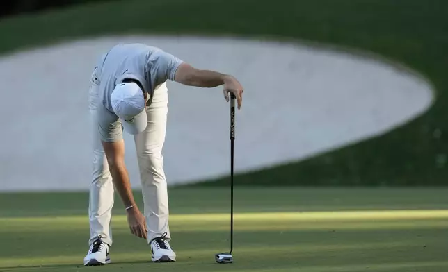 Rory McIlroy, of Northern Ireland, reacts after missing a putt on the 13th hole during second round at the Masters golf tournament at Augusta National Golf Club Friday, April 12, 2024, in Augusta, Ga. (AP Photo/David J. Phillip)