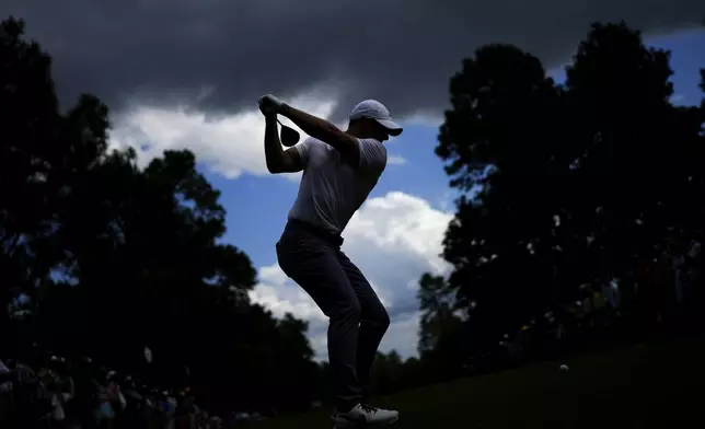Rory McIlroy, of Northern Ireland, hits his tee shot on the ninth hole during the first round at the Masters golf tournament at Augusta National Golf Club Thursday, April 11, 2024, in Augusta, Ga. (AP Photo/Matt Slocum)