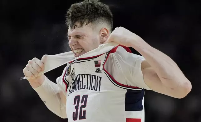 UConn center Donovan Clingan (32) reacts to a foul call during the second half of the NCAA college Final Four championship basketball game against Purdue, Monday, April 8, 2024, in Glendale, Ariz. (AP Photo/David J. Phillip)