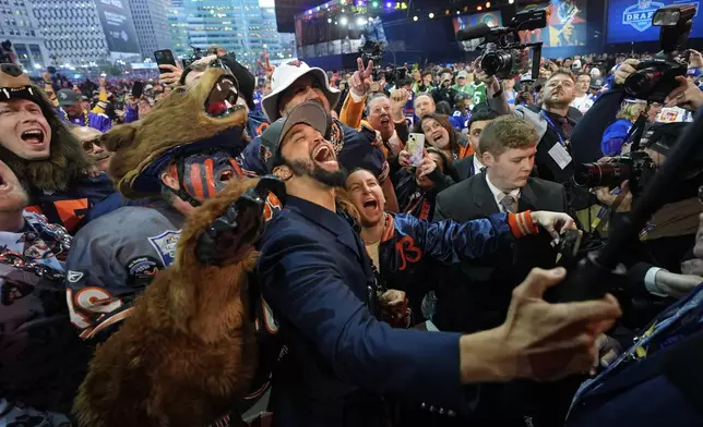 Southern California quarterback Caleb Williams celebrates after being chosen by the Chicago Bears with the first overall pick during the first round of the NFL football draft, Thursday, April 25, 2024, in Detroit. (AP Photo/Paul Sancya)