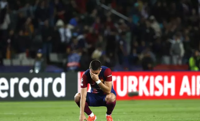 Barcelona's Ferran Torres reacts at the end of the Champions League quarterfinal second leg soccer match between Barcelona and Paris Saint-Germain at the Olimpic Lluis Companys stadium in Barcelona, Spain, Tuesday, April 16, 2024. (AP Photo/Joan Monfort)
