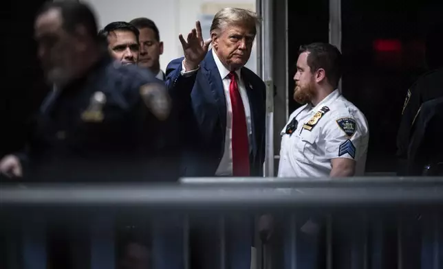Former President Donald Trump walks back into the courtroom following a lunch break at the Manhattan criminal court ahead of jury selection in New York, Monday, April 15, 2024. (Jabin Botsford/The Washington Post via AP, Pool)