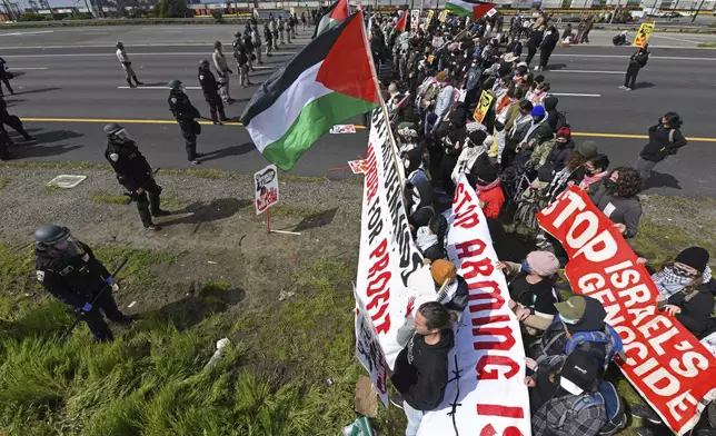 Protesters opposed to the war in Gaza block southbound Interstate 880 in Oakland, Calif., Monday, April 15, 2024. (Jose Carlos Fajardo/Bay Area News Group via AP)
