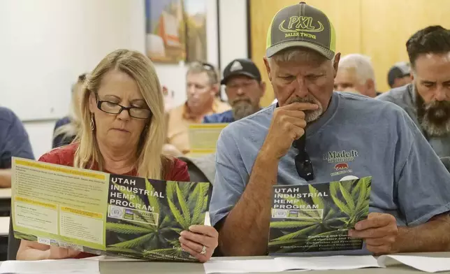 FILE - Alfalfa farmers Diane and Russ Jones look on during a public hearing on medical cannabis at the Utah Department of Agriculture and Food, June 5, 2019, in Salt Lake City, Utah. Medical marijuana is now legal in 38 states. (AP Photo/Rick Bowmer, File)