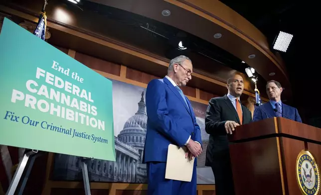 FILE - From left, Senate Majority Leader Chuck Schumer, D-N.Y., Sen. Cory Booker, D-N.J., and Sen. Ron Wyden, D-Ore., announce a draft bill that would decriminalize marijuana on a federal level Capitol Hill in Washington, Wednesday, July 14, 2021. The bill, called the Cannabis Administration and Opportunity Act, would not only decriminalize marijuana, but also expunge the records of those with non-violent convictions related to cannabis and invest money into restorative justice programs. (AP Photo/Amanda Andrade-Rhoades, File)