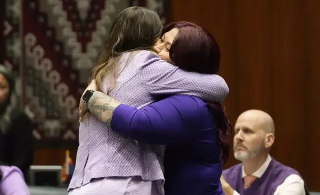 Arizona Rep. Stephanie Stahl Hamilton, D-Tucson, left, gets a hug from Sen. Anna Hernandez, D-Phoenix, after the vote tally on the proposed repeal of Arizona's near-total ban on abortions winning approval from the state House Wednesday, April 24, 2024, in Phoenix. (AP Photo/Ross D. Franklin)