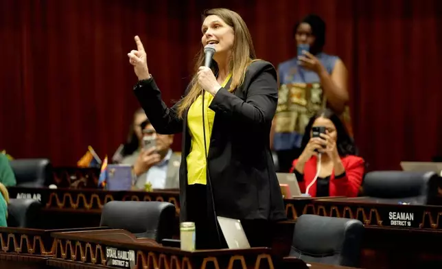 Arizona State Rep. Stephanie Stahl Hamliton, D, speaks on floor at the Capitol, Wednesday, April 10, 2024, in Phoenix. The Arizona Supreme Court ruled Tuesday that the state can enforce its long-dormant law criminalizing all abortions except when a mother's life is at stake. (AP Photo/Matt York)