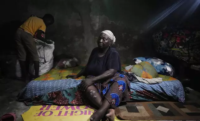 Funmilayo Kotun, 66-years-old, a malaria patient is photographed in her one room in Makoko neighbourhood of Lagos, Nigeria, Saturday, April 20, 2024. When cases of locally transmitted malaria were found in the United States last year, it was a reminder that climate change is reviving the threat, or broadening the range, of some diseases. But across the African continent malaria has never left.(AP Photo/Sunday Alamba)