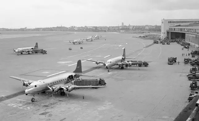 FILE - U.S. Air Force Skymasters line up at Tempelhof Airport, Berlin, Germany on July 7, 1948, to unload the first shipment of coal flown to blockaded Berlin. A Douglas C-54 Skymaster has crashed into the Tanana River outside Fairbanks, Alaska. The C-54 is a military version of the Douglas DC-4, which was a World War II-era airplane. The website www.airlines.net said standard passenger seating for a DC-4 was 44 during its heyday, but most have been converted to freighters. (AP Photo/Henry Burroughs, File)