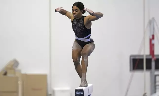 Gabby Douglas competes on the balance beam at the American Classic Saturday, April 27, 2024, in Katy, Texas. (AP Photo/David J. Phillip)