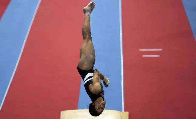 Gabby Douglas competes on the vault at the American Classic Saturday, April 27, 2024, in Katy, Texas. (AP Photo/David J. Phillip)