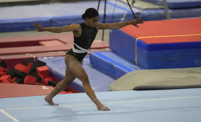 Gabby Douglas performs her floor routine while competing at the American Classic Saturday, April 27, 2024, in Katy, Texas. (AP Photo/David J. Phillip)