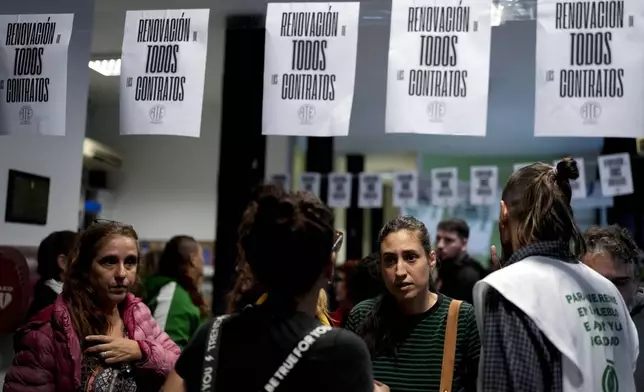 State workers, some who have been laid off, gather inside the National Institute against Discrimination, Xenophobia, and Racism in Buenos Aires, Argentina, Wednesday, April 3, 2024. According to the State Workers Association, more than 11 thousand dismissals of state employees have been carried out by Javier Milei’s government. The union is calling for massive and simultaneous re-entry of dismissed individuals. (AP Photo/Natacha Pisarenko)