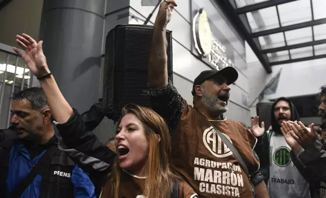 Demonstrators chant slogans during an anti-government protest after some workers were laid off as part of state economic downsizing measures, in Buenos Aires, Argentina, Wednesday, April 3, 2024. (AP Photo/Gustavo Garello)