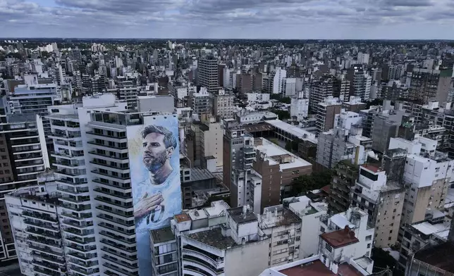 A mural of soccer player Lionel Messi covers a building in Rosario, Argentina, Monday, April 8, 2024. The birthplace of Messi and revolutionary Ernesto “Che” Guevara morphed about a decade ago into the country’s drug trafficking hub, as regional crackdowns pushed the trade south. (AP Photo/Natacha Pisarenko)
