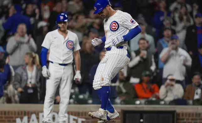 Chicago Cubs' Mike Tauchman homers during the eighth inning of a baseball game against the Houston Astros, Tuesday, April 23, 2024, in Chicago. (AP Photo/Erin Hooley)