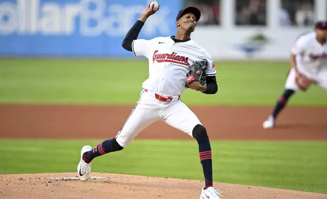 Cleveland Guardians starting pitcher Triston McKenzie delivers during the first inning of the team's baseball game against the Oakland Athletics, Friday, April 19, 2024, in Cleveland. (AP Photo/Nick Cammett)