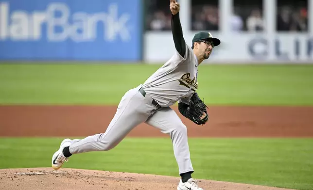 Oakland Athletics starting pitcher Joe Boyle delivers during the first inning of the team's baseball game against the Cleveland Guardians, Friday, April 19, 2024, in Cleveland. (AP Photo/Nick Cammett)
