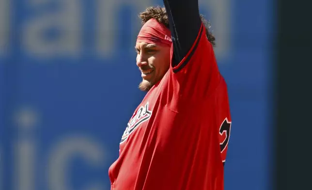 Cleveland Guardians' Josh Naylor celebrates after hitting a three-run double during the seventh inning of a baseball game against the Oakland Athletics, Sunday, April 21, 2024, in Cleveland. (AP Photo/Nick Cammett)