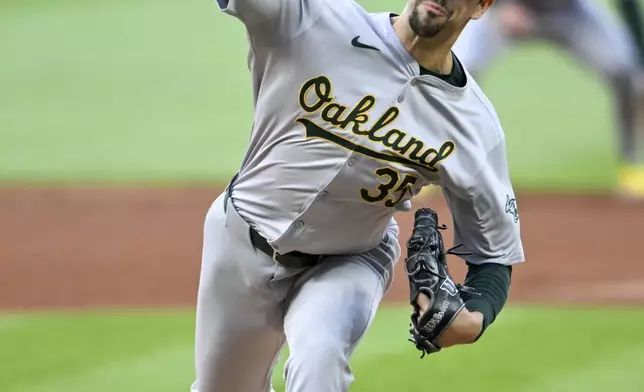 Oakland Athletics starting pitcher Joe Boyle delivers during the first inning of the team's baseball game against the Cleveland Guardians, Friday, April 19, 2024, in Cleveland. (AP Photo/Nick Cammett)