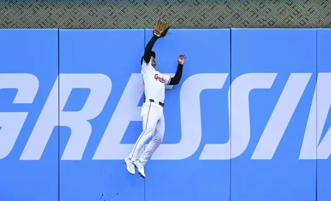 Cleveland Guardians' Steven Kwan catches a fly ball hit by Oakland Athletics' Max Schuemann during the second inning of a baseball game Saturday, April 20, 2024, in Cleveland. (AP Photo/Nick Cammett)