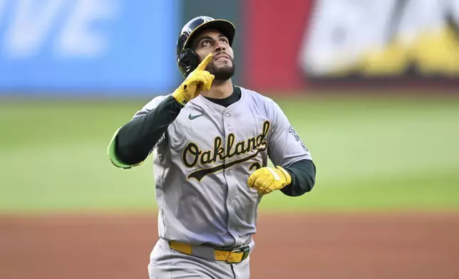 Oakland Athletics' Abraham Toro celebrates a solo home run off Cleveland Guardians starting pitcher Triston McKenzie during the first inning of a baseball game Friday, April 19, 2024, in Cleveland. (AP Photo/Nick Cammett)