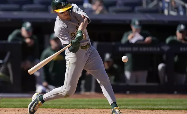 Oakland Athletics' Zack Gelof hits a two-run home run during the ninth inning of the baseball game against the New York Yankees at Yankee Stadium Monday, April 22, 2024, in New York. (AP Photo/Seth Wenig)