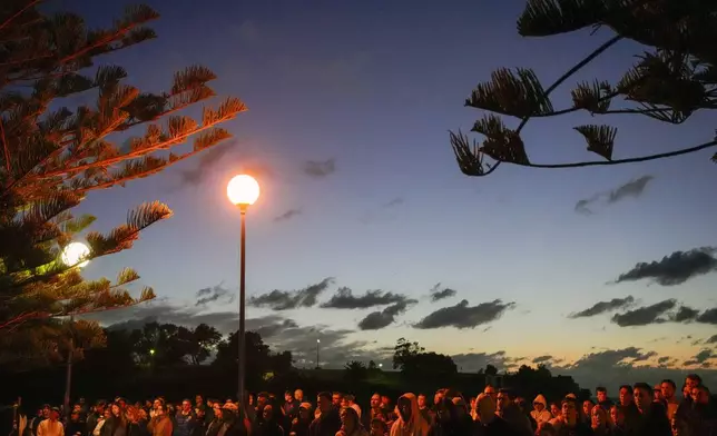 Crowds attend the Anzac Day dawn service at Coogee Beach in Sydney, Australia, Thursday, April 25, 2024. (AP Photo/Mark Baker)