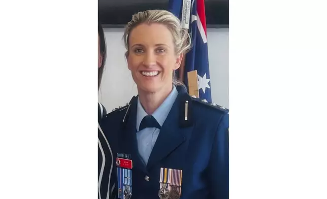 In this undated photo provided by the New South Wales Police, Inspector Amy Scott poses for a photo at an unknown location in Australia. Scott fatally shot a man who stabbed and killed multiple people at a suburban Sydney shopping center, Saturday, April 13, 2024. (NSW Police via AP)