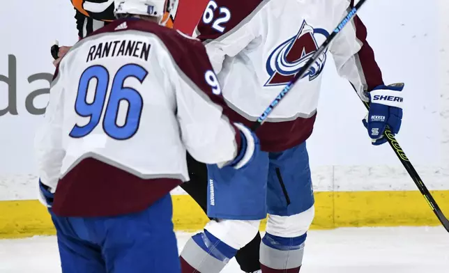 Colorado Avalanche's Artturi Lehkonen (62) celebrates his goal against the Winnipeg Jets with Mikko Rantanen (96) during the second period in Game 2 of an NHL hockey Stanley Cup first-round playoff series Tuesday, April 23, 2024, in Winnipeg, Manitoba. (Fred Greenslade/The Canadian Press via AP)