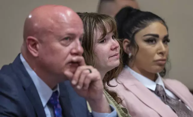 Hannah Gutierrez Reed, center, with her attorney Jason Bowles and paralegal Carmella Sisneros during her sentencing hearing in state district court in Santa Fe, New Mexico, on Monday, April 15, 2024. Reed, the armorer on the set of the Western film "Rust," was sentenced to 18 months in prison for involuntary manslaughter in the death of cinematographer Halyna Hutchins, who was fatally shot by Alec Baldwin in 2021. (Eddie Moore/The Albuquerque Journal via AP, Pool)