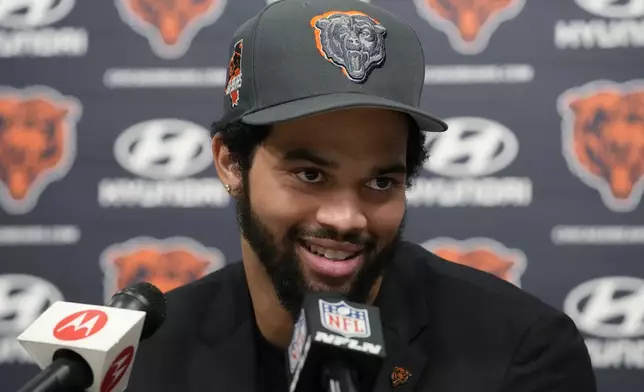 Chicago Bears No. 1 draft pick quarterback Caleb Williams listens to reporters during an NFL football news conference in Lake Forest, Ill., Friday, April 26, 2024. (AP Photo/Nam Y. Huh)