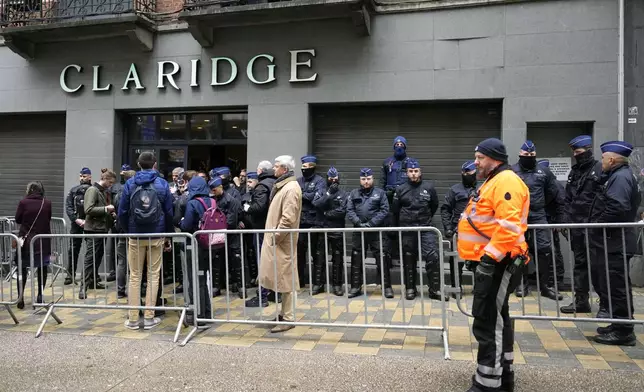 Police guard outside the front entrance of the event venue as the National Conservatism conference takes place in Brussels, Tuesday, April 16, 2024. (AP Photo/Virginia Mayo)