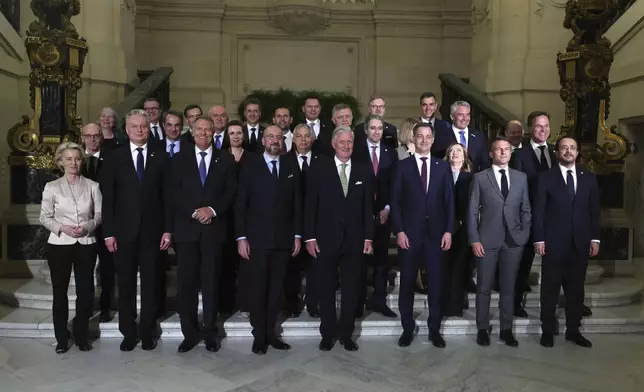 Belgium's King Philippe, center front, poses for a group photo with European Union leaders during a reception at the Royal Palace prior to an EU summit in Brussels, Wednesday, April 17, 2024. (Olivier Hoslet, Pool Photo via AP)