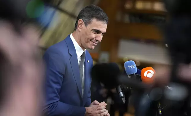 Spain's Prime Minister Pedro Sanchez speaks with the media as he arrives for an EU summit in Brussels, Wednesday, April 17, 2024. European leaders' discussions at a summit in Brussels were set to focus on the bloc's competitiveness in the face of increased competition from the United States and China. Tensions in the Middle East and the ongoing war between Russia and Ukraine decided otherwise and the 27 leaders will dedicate Wednesday evening talks to foreign affairs. (AP Photo/Virginia Mayo)
