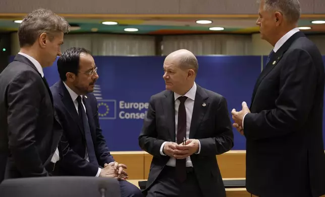 From left, Slovenia's Prime Minister Robert Golob, Cypriot President Nikos Christodoulides, Germany's Chancellor Olaf Scholz and Romania's President Klaus Werner Ioannis during a round table meeting at an EU summit in Brussels, Wednesday, April 17, 2024. European leaders' discussions at a summit in Brussels were set to focus on the bloc's competitiveness in the face of increased competition from the United States and China. Tensions in the Middle East and the ongoing war between Russia and Ukraine decided otherwise and the 27 leaders will dedicate Wednesday evening talks to foreign affairs. (AP Photo/Omar Havana)