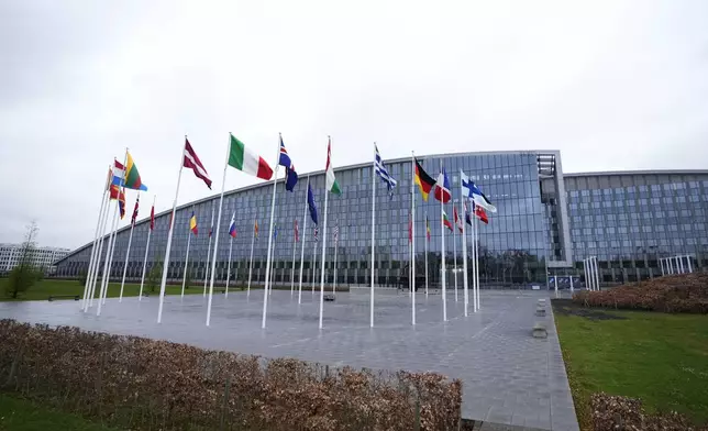 Flags of NATO member countries flap in the wind outside NATO headquarters in Brussels, Wednesday, April 3, 2024. NATO foreign ministers gathered in Brussels on Wednesday to debate plans to provide more predictable, longer-term support to Ukraine. (AP Photo/Virginia Mayo)