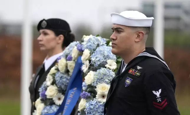 Two military personnel stand guard during a wreath laying ceremony at NATO headquarters in Brussels, Thursday, April 4, 2024. NATO celebrates on Thursday 75 years of collective defense across Europe and North America as Russia's war on Ukraine enters its third year. (AP Photo/Virginia Mayo)
