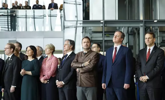 From left, Sweden's Foreign Minister Tobias Billstrom, Germany's Foreign Minister Annalena Baerbock, Canada's Foreign Minister Melanie Joly, United States Secretary of State Antony Blinken, Luxembourg's Foreign Minister Xavier Bettel, British Foreign Secretary David Cameron and Poland's Foreign Minister Radoslaw Sikorski attend a ceremony to mark the 75th anniversary of NATO at NATO headquarters in Brussels, Thursday, April 4, 2024. NATO marked on Thursday 75 years of collective defense across Europe and North America, with its top diplomats vowing to stay the course in Ukraine as better armed Russian troops assert control on the battlefield. (AP Photo/Geert Vanden Wijngaert)
