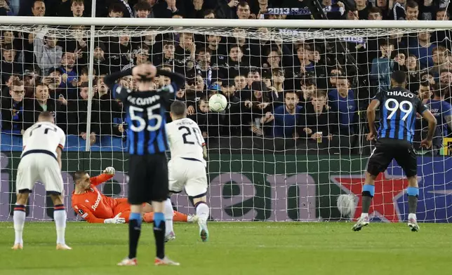 PAOK's goalkeeper Dominik Kotarski, second left, makes a save during a penalty shot by Brugge's Igor Thiago, right, during the Europa Conference League quarter final first leg soccer match between Club Brugge and PAOK at the Jan Breydel Stadium in Bruges, Belgium, Thursday, April 11, 2024. (AP Photo/Geert Vanden Wijngaert)