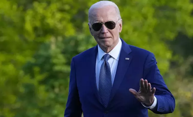 President Joe Biden waves as he walks across the South Lawn of the White House in Washington, Tuesday, April 23, 2024, after returning from a trip to Florida where he blamed Donald Trump for Florida's upcoming abortion ban. (AP Photo/Susan Walsh)
