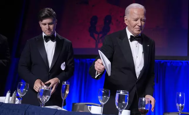 President Joe Biden, right, and host Colin Jost attend the White House Correspondents' Association Dinner at the Washington Hilton, Saturday, April 27, 2024, in Washington. (AP Photo/Manuel Balce Ceneta)