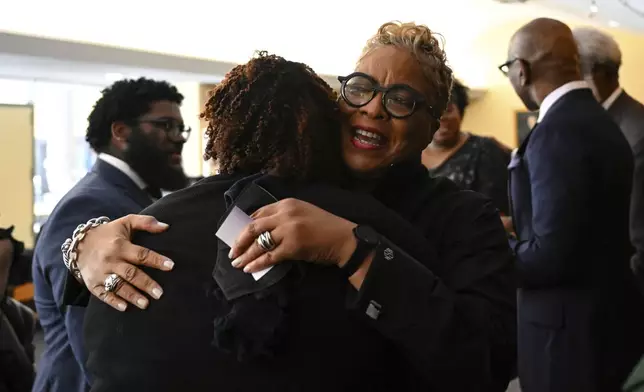 Rev. Gina Stewart, right, hugs a parishioner after church service at Rankin Chapel, Sunday, April 7, 2024, in Washington. Throughout its long history, the Black Church in America has, for the most part, been a patriarchal institution. Now, more Black women are taking on high-profile leadership roles. But the founder of Women of Color in Ministry estimates that less than one in 10 Black Protestant congregations are led by a woman. “I would hope that we can knock down some of those barriers so that their journey would be just a little bit easier,” said Stewart. (AP Photo/Terrance Williams)