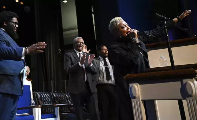 Rev. Gina Stewart, right, preaches during church service at Rankin Chapel, Sunday, April 7, 2024, in Washington. Throughout its long history, the Black Church in America has, for the most part, been a patriarchal institution. Now, more Black women are taking on high-profile leadership roles. But the founder of Women of Color in Ministry estimates that less than one in 10 Black Protestant congregations are led by a woman. “I would hope that we can knock down some of those barriers so that their journey would be just a little bit easier,” said Stewart. (AP Photo/Terrance Williams)