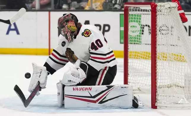 Chicago Blackhawks goaltender Arvid Soderblom (40) stops a shot during the second period of an NHL hockey game against the Los Angeles Kings Thursday, April 18, 2024, in Los Angeles. (AP Photo/Ashley Landis)