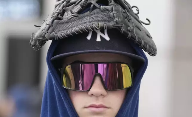 Trevor Petrowsky waits in line to enter Yankee Stadium in New York before the home opener baseball game between the New York Yankees and Toronto Blue Jays, Friday, April 5, 2024. (AP Photo/Seth Wenig)
