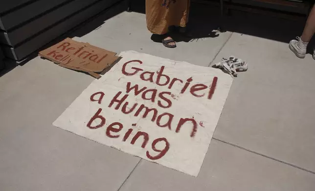 A sign referring to Gabriel Cuen-Buitimea, a Mexican man found dead on the ranch of George Alan Kelly, sits outside the Santa Cruz County Courthouse on Monday, April 29, 2024. Kelly's trial on a charge of second-degree murder ended last week with a deadlocked jury, and prosecutors said Monday during a hearing that they would not retry him. (Angela Gervasi/Nogales International via AP)