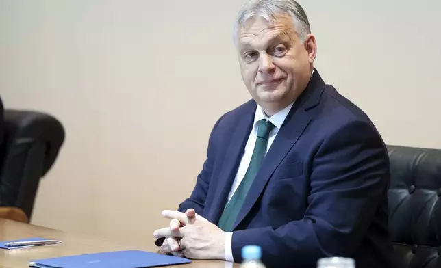 Hungarian Prime Minister Viktor Orban smiles during the meeting with the President of the Council of Ministers of Bosnia and Herzegovina Borjana Kristo in Sarajevo, Bosnia, Thursday, April 4, 2024. (AP Photo)