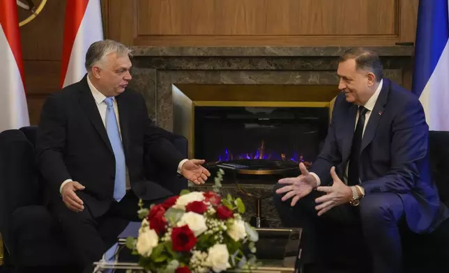 Bosnian Serb leader Milorad Dodik, right, talks to Hungary's Prime Minister Viktor Orban, during their meeting in Banja Luka, Bosnia, Friday, April 5, 2024. (AP Photo/Darko Bandic)